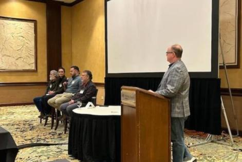 A panel of forestry professionals speaks at the Society of American Foresters Kentucky–Tennessee Winter Meeting in Knoxville, Tennessee, discussing forest management and silviculture practices.
