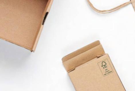 Close-up of recyclable brown cardboard packaging featuring the FSC label, symbolizing responsibly sourced materials used in pharmaceutical or consumer packaging.