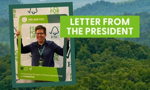 Sarah Billig, FSC US President, holding "We are FSC" sign and smiling.